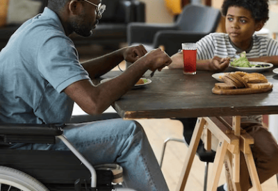 disabled-father-son-having-lunch-together_249974-13348